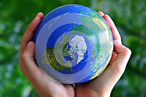 Globe holded in hands