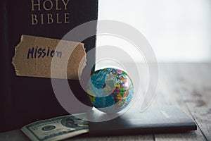 Globe with Holy Bible for mission, Mission christian idea. bible and book on wooden table, Christian background for great