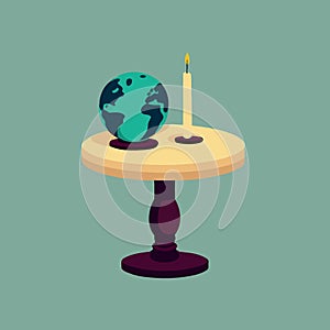 a globe and a lit candle to represent the campaign against climate change called earth hour