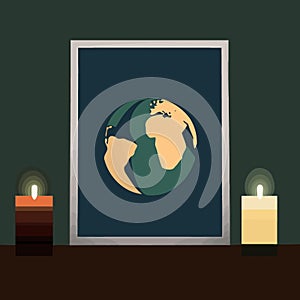 a globe and a lit candle to represent the campaign against climate change called earth hour