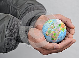 Globe in man's hands