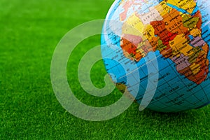 globe model on green grass