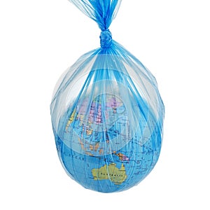 Globe of planet Earth dressed in a garbage plastic bag isolated on white.