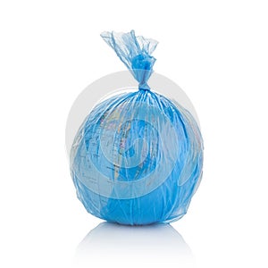 Globe of planet Earth dressed in a garbage plastic bag  on white.