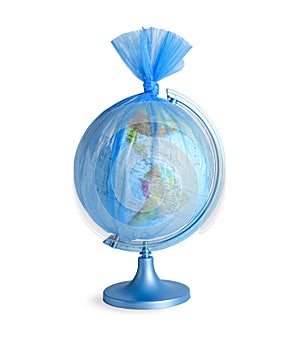 Globe in plastic bag isolated on white. Environmental conservation