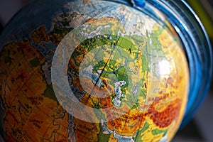 Globe with Russian letters with the focus on Europe close-up