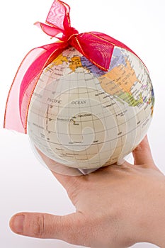 Globe tied with ribbon