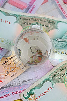 Globe on uae currency dirham notes