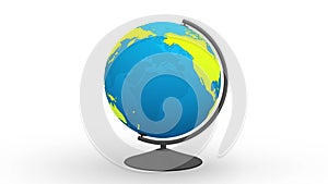 Globe on white desktop - transparent model of blue planet earth with green world map rotating around axis