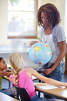 Globe, woman teacher and children in classroom for geography education, world learning and earth knowledge. African