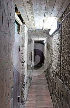 Gloomy corridor with the door underground