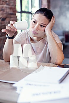 Gloomy female freelancer doing nothing