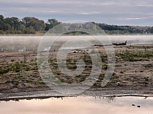 Gloomy foggy morning on the Irtysh river