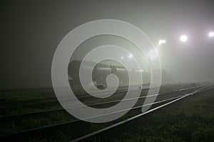 Gloomy railway in the fog