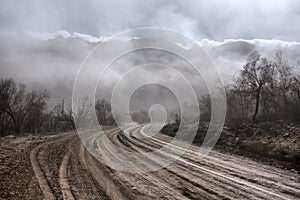 Gloomy road in mountains