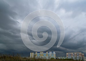 Gloomy skies and thunderclouds hung over the multi-storey buildings