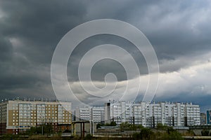 Gloomy skies and thunderclouds hung over the multi-storey buildings