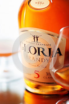 Gloria brandy bottle and two glasses