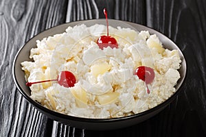 Glorified Rice is a cold dessert salad made with rice, crushed pineapple, maraschino cherries, and marshmallows tossed with a