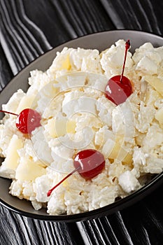Glorified Rice is a cold dessert salad made with rice, crushed pineapple, marshmallows, sweetened whipped cream, and maraschino