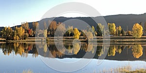 Glorious fall colors reflected on Frenchtown Pond assorted photo