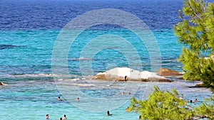 A glorious Greek beach with a small rock for diving in area of Kavourotripes Halkidiki Greece