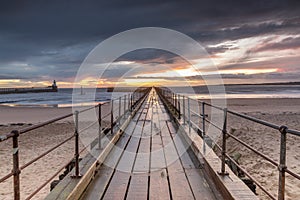 A glorious morning at Blyth beach, with a beautiful sunrise over the old wooden Pier stretching out to the North Sea