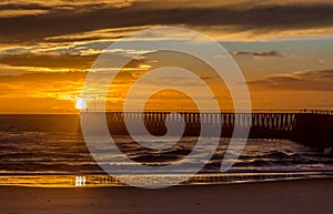 A glorious morning at Blyth beach, with a beautiful sunrise over the old wooden Pier stretching out to the North Sea