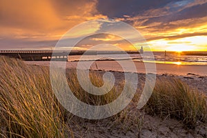 A glorious morning at Blyth beach, with a beautiful sunrise over the old wooden Pier stretching out to the North Sea