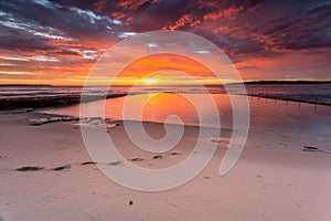 Glorious sunrise and ocean rock pool beach Cronulla