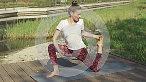 Glorious woman doing yoga in nature