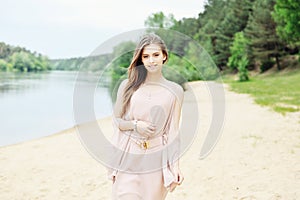 Glorious young woman in white dress photo