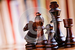 Glossy Black Wooden Chess Pieces on Board