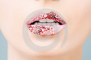 Glossy lips, beautiful makeup with red and pink lipstick. Close up macro beautiful mouth