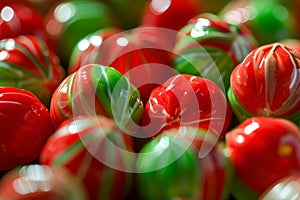 Glossy red and green striped gummy candies, reminiscent of watermelons, in a close-up view