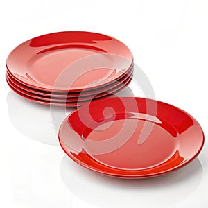 Glossy red plates isolated photo