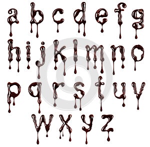 Glossy small letters of the Latin alphabet made of chocolate with dripping drops isolated on a white background