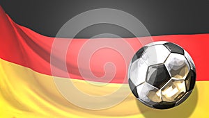 Glossy soccer football ball front of german flag. Germany