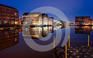 Gloucester docks on sharpness canal. Warehouse apartments reflected in quay water