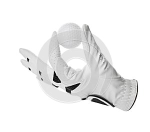 Glove and golf ball on white