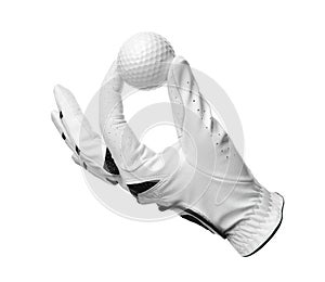 Glove and golf ball on white