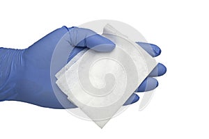 Gloved hand holding an antibacteria cleansing wipe photo