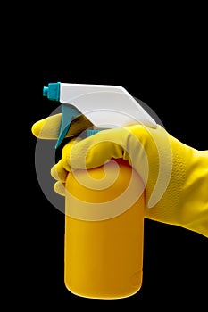 Gloved hand holding spray bottle