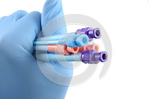 Gloved hand holding surgical introducers photo