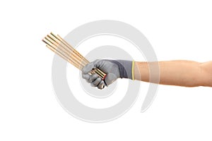 Gloved hand holding a wooden meter on white background