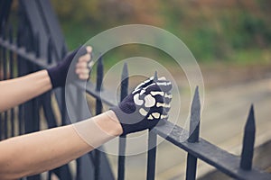 Gloved hands grabbing railings