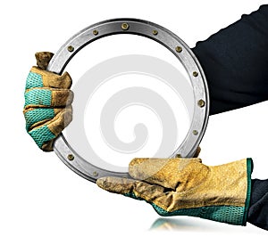 Gloved Hands Holding a Metal Porthole with a Copy Space