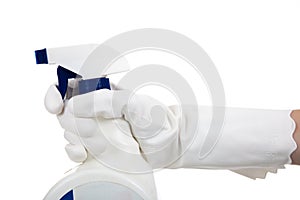 A gloved hands holding a spray bottle of cleaning, disinfecting chemical on a white background