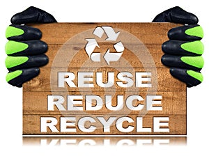 Gloved Hands Holding a Wooden Plank with Text - Reuse Reduce Recycle