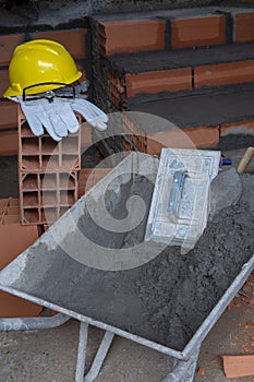 Gloves, helmet and goggles on pile of bricks